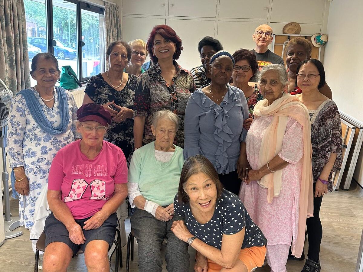 A group photo at a MAXHer 50+ event.
